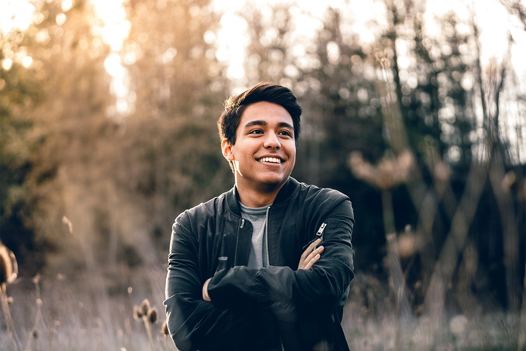 man smiling in field