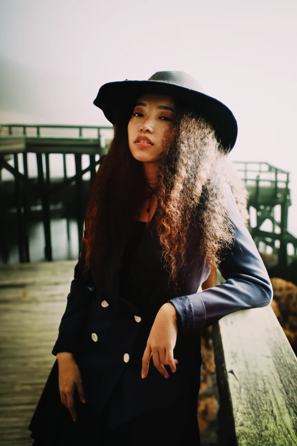 woman leaning on Ocean pier